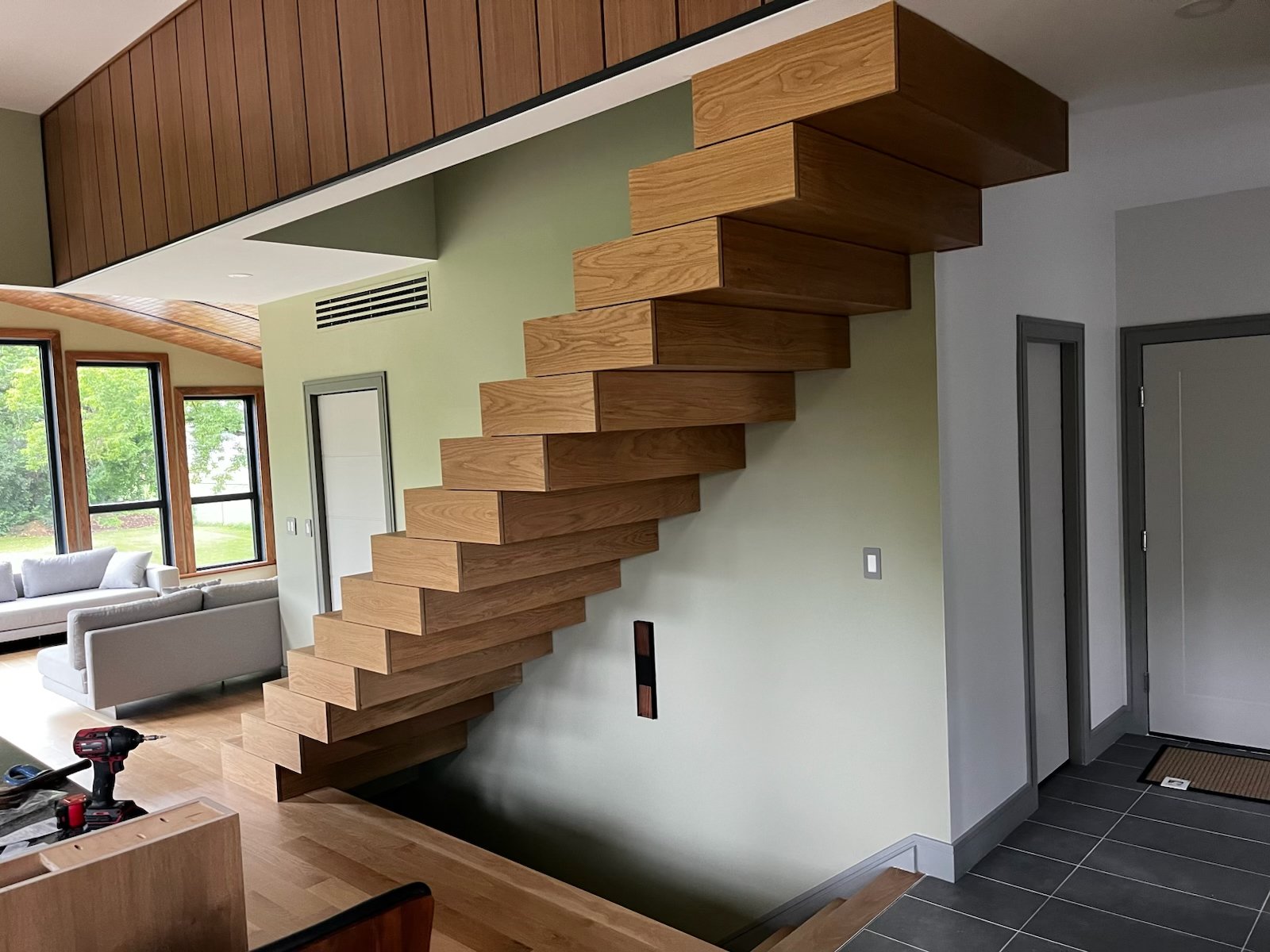 Custom floating wood staircase integrated into a contemporary home